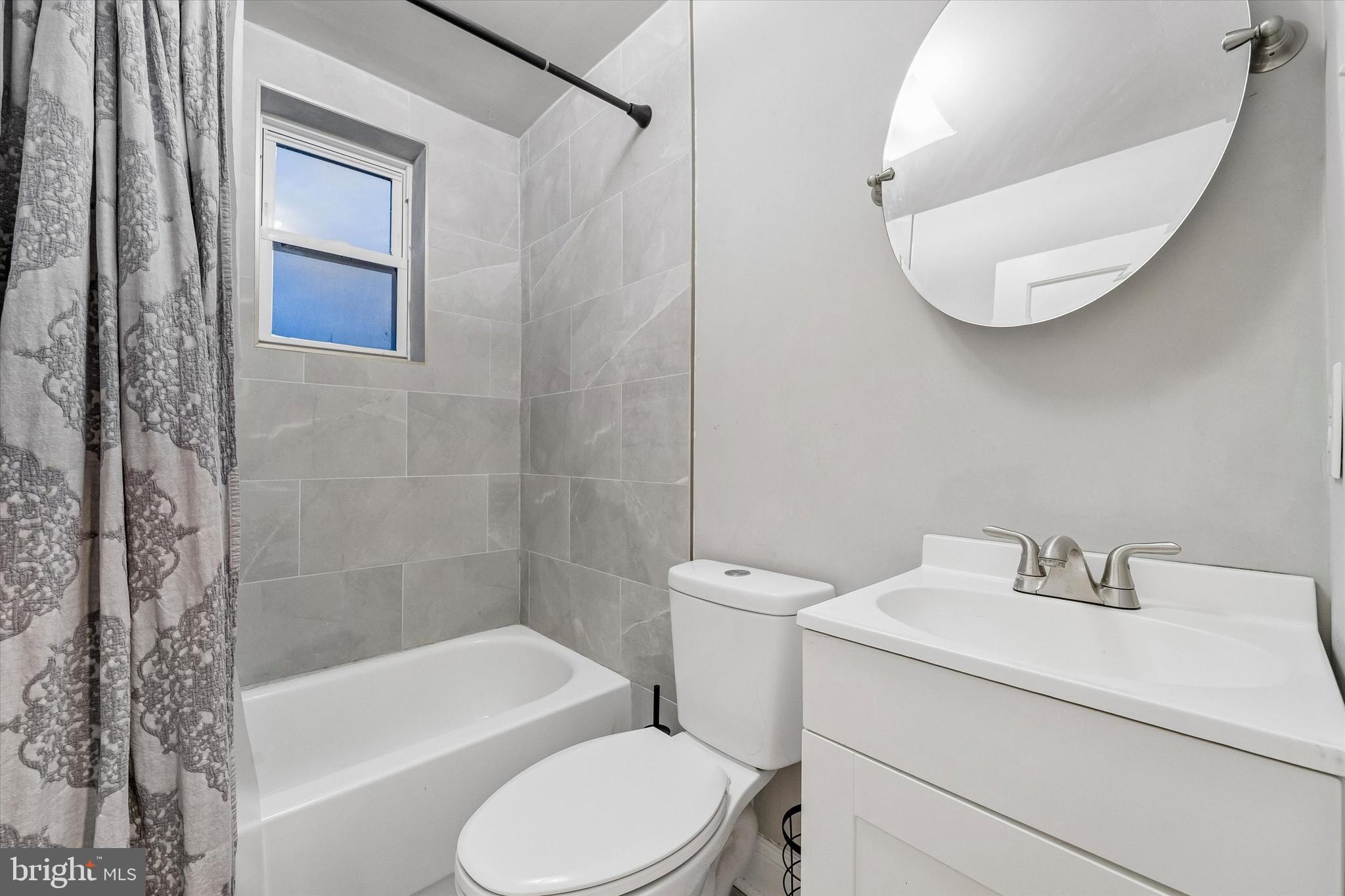 332 Springton Road Upper Darby, PA 19082 - Photo 9 of 15 a bathroom with a toilet and a bathtub