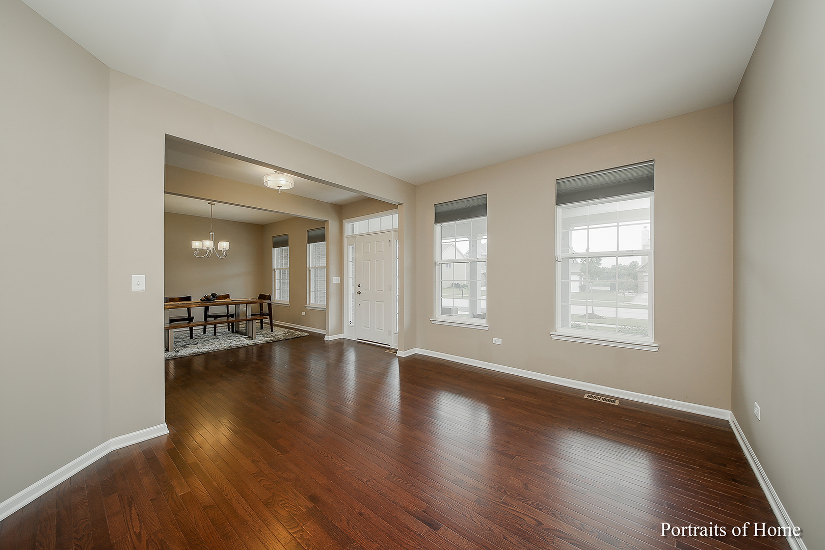 3740 Ryder Court Naperville, IL 60564 - Photo 11 of 25 an empty room with wooden floor and windows