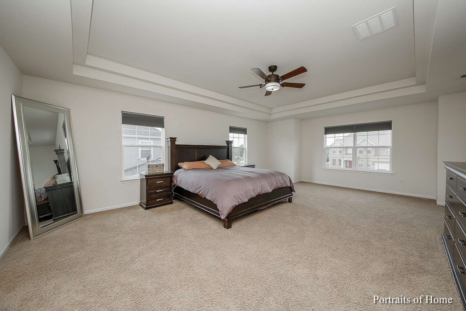 3740 Ryder Court Naperville, IL 60564 - Photo 16 of 25 a bedroom with a bed and a ceiling fan