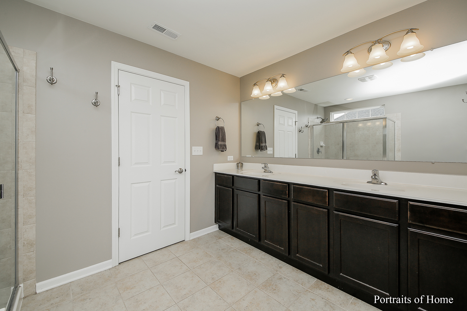 3740 Ryder Court Naperville, IL 60564 - Photo 17 of 25 a spacious bathroom with double vanity and a mirror