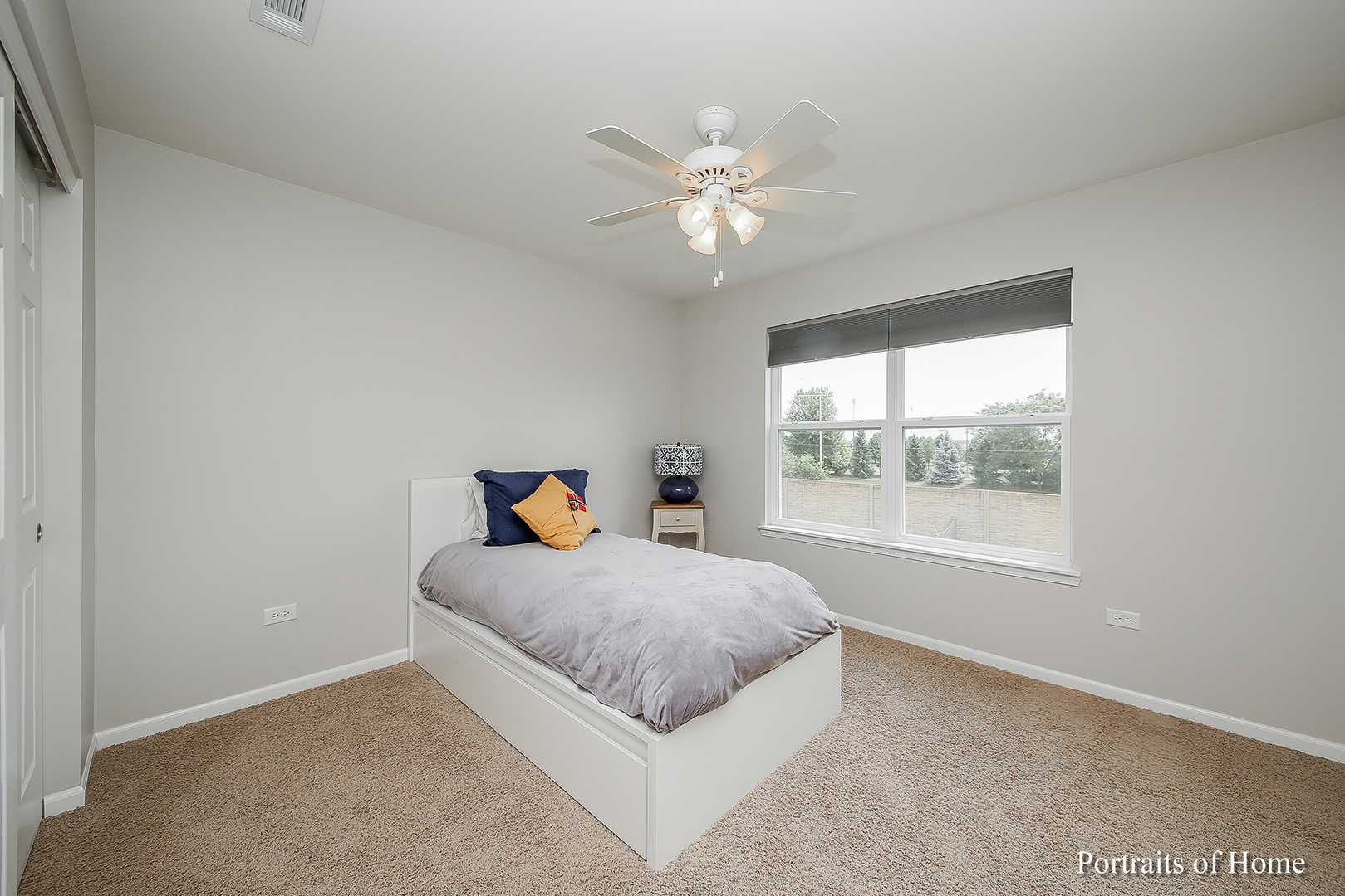 3740 Ryder Court Naperville, IL 60564 - Photo 19 of 25 a living room with a bed and a window