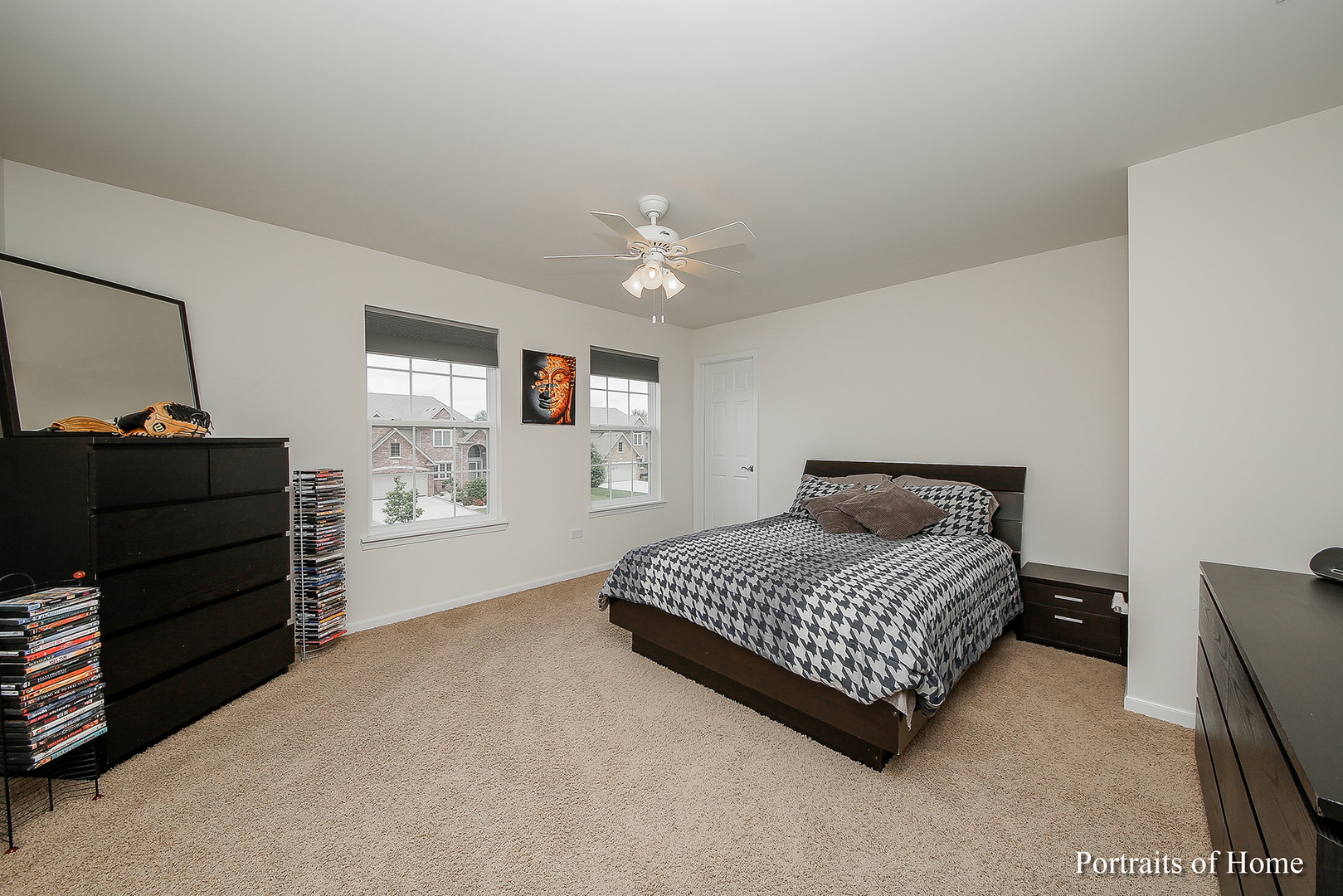 3740 Ryder Court Naperville, IL 60564 - Photo 21 of 25 a bedroom with a bed and a dresser