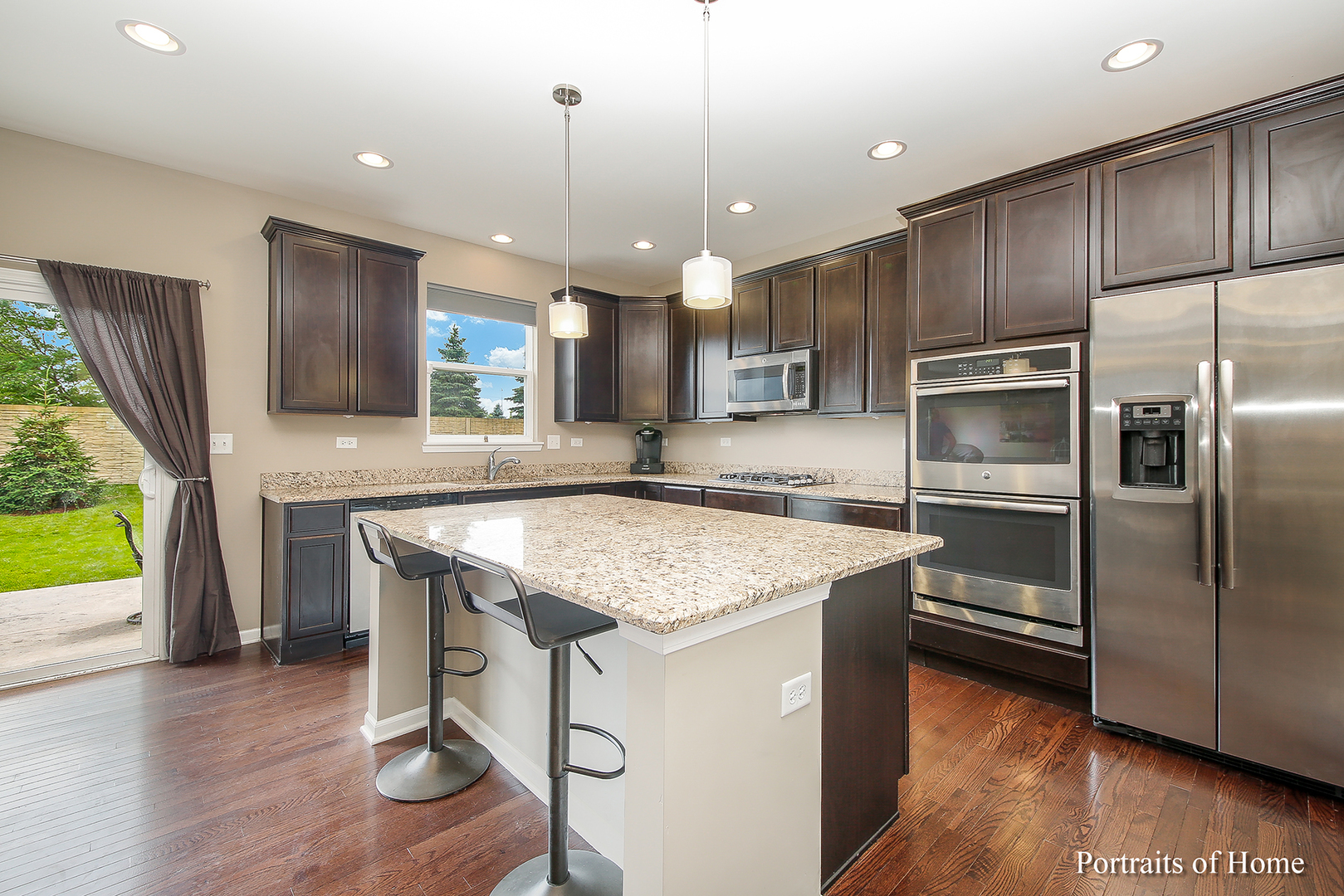 3740 Ryder Court Naperville, IL 60564 - Photo 5 of 25 a kitchen with kitchen island a counter top space appliances and cabinets