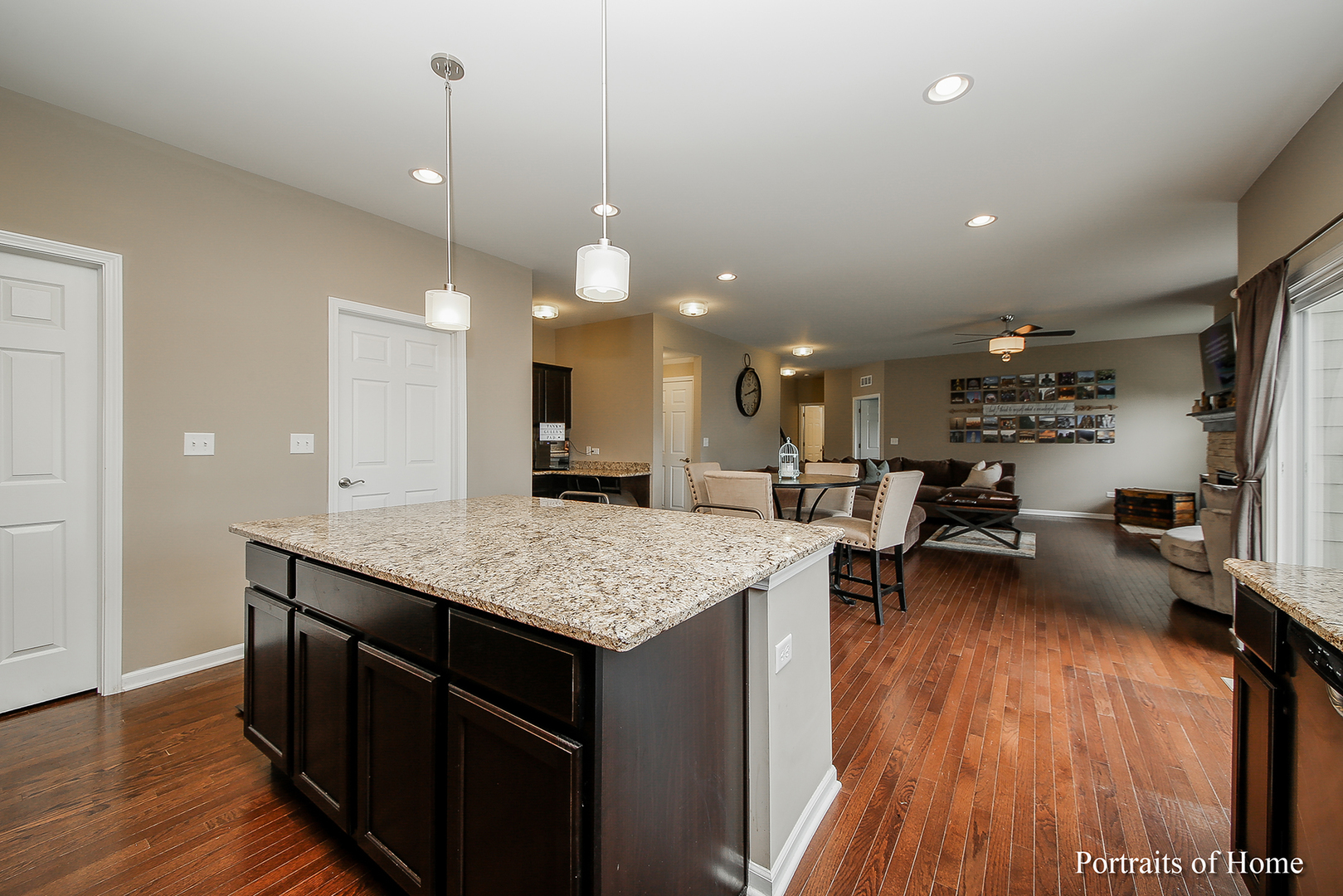 3740 Ryder Court Naperville, IL 60564 - Photo 6 of 25 a kitchen with stainless steel appliances granite countertop a sink stove and wooden floor
