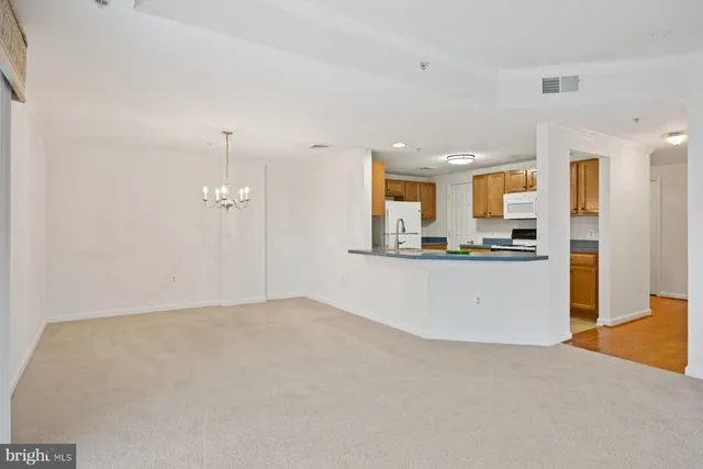 a kitchen with sink and cabinets