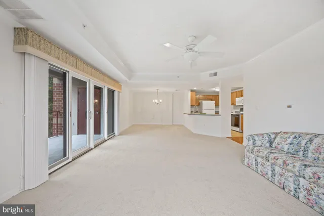 a kitchen with a stove a sink and a window
