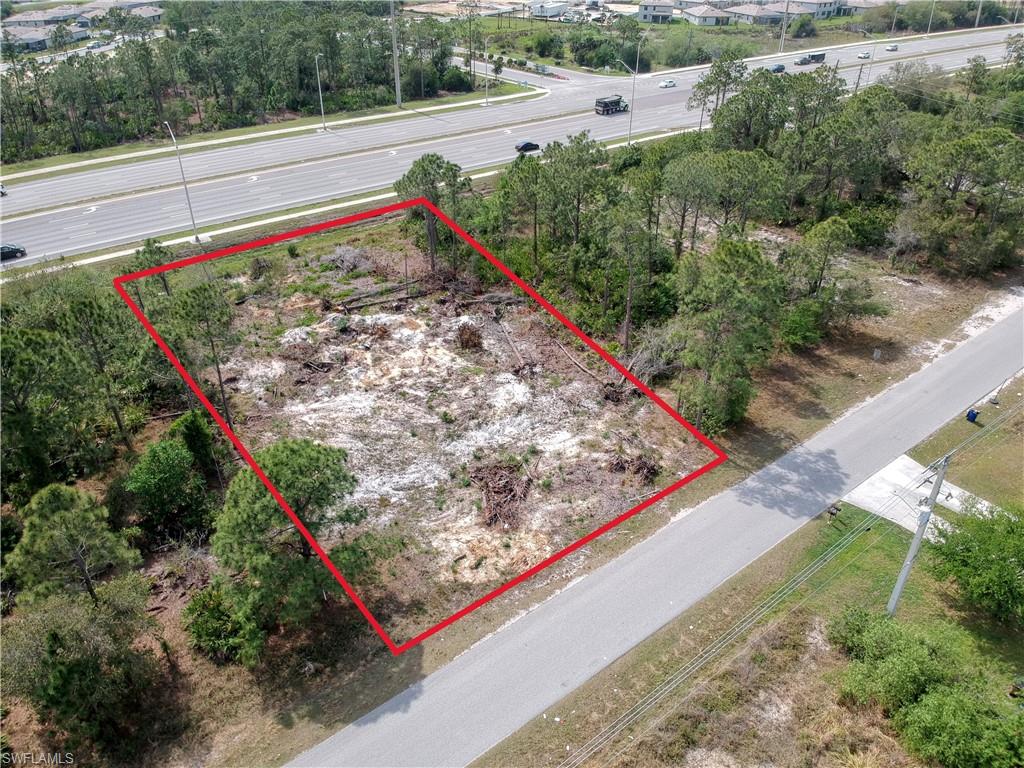 924 Meadow Road Lehigh Acres, FL 33913 - Photo 3 of 5 a view of a yard with wooden street