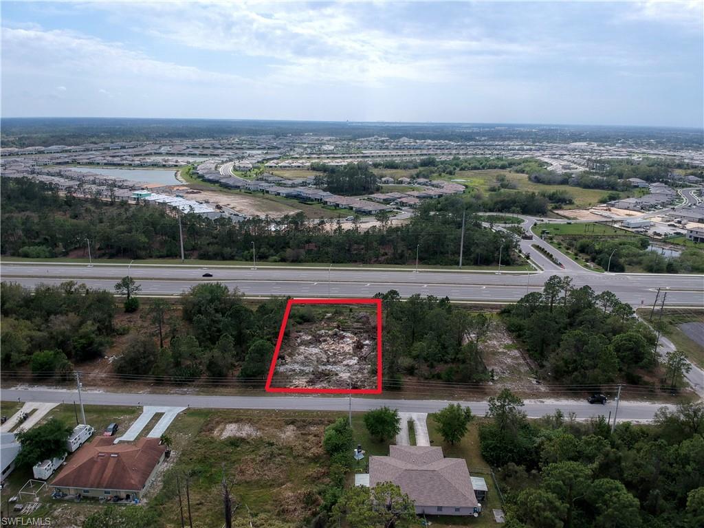 924 Meadow Road Lehigh Acres, FL 33913 - Photo 4 of 5 an aerial view of a city
