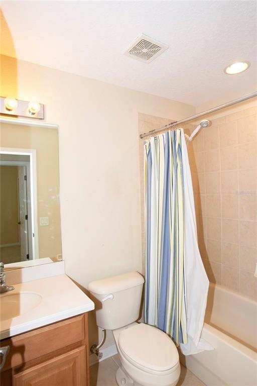 11919 Essington Street New Port Richey, FL 34654 - Photo 18 of 46 a bathroom with a toilet and a sink