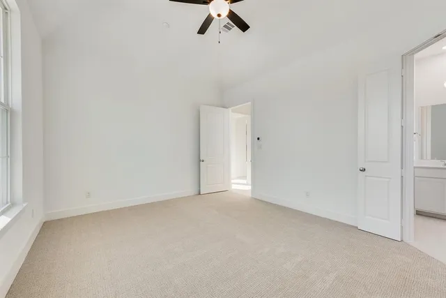 a bathroom with a double vanity sink mirror and bathtub
