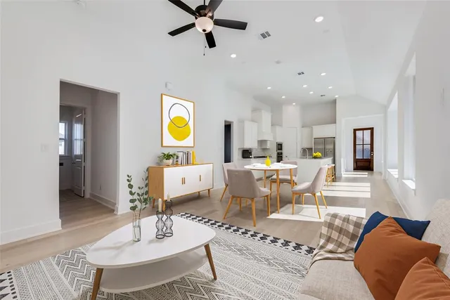 a kitchen with a sink a counter top space and stainless steel appliances