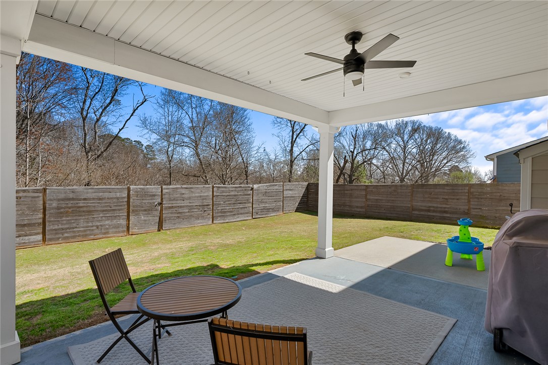 115 Bronson Ridge Anderson, SC 29621 - Photo 35 of 40 A sheltered concrete terrace looks out over a level, fully enclosed backyard.