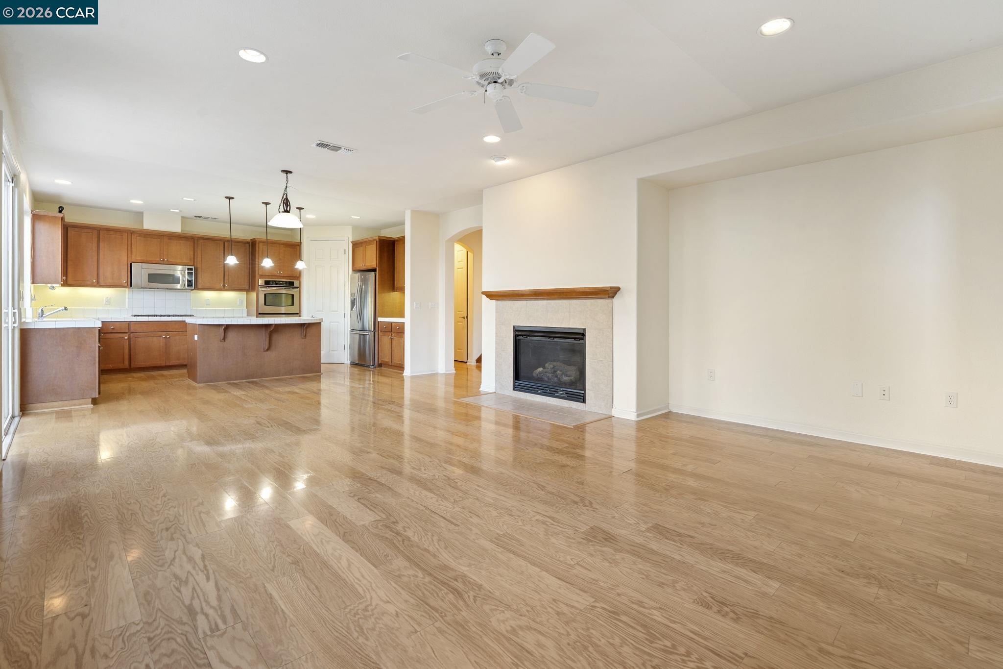5141 Fern Ridge Circle Discovery Bay, CA 94505 - Photo 14 of 56 a view of kitchen and dining room with wooden floor