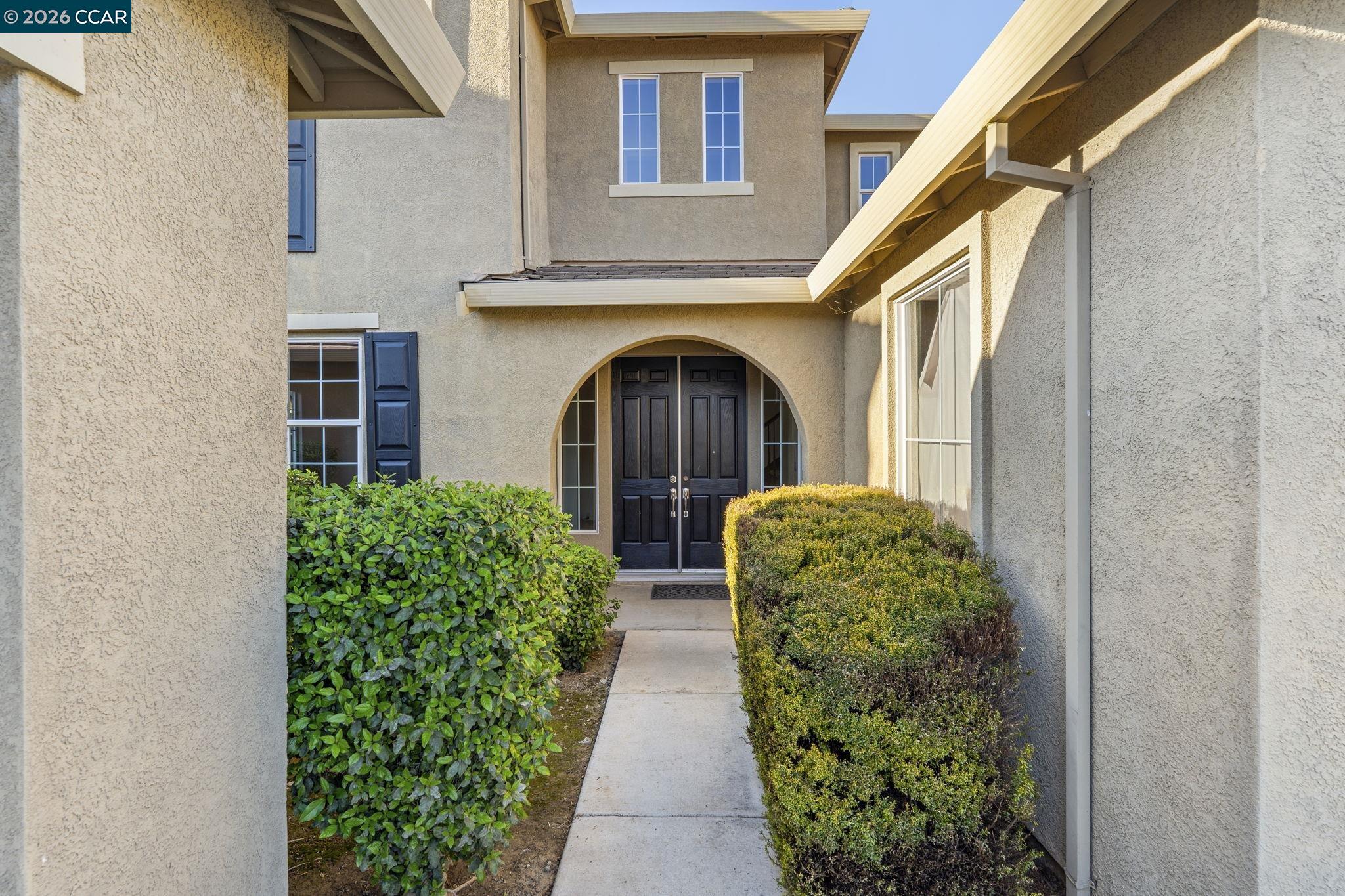 5141 Fern Ridge Circle Discovery Bay, CA 94505 - Photo 3 of 56 a front view of a house with garden
