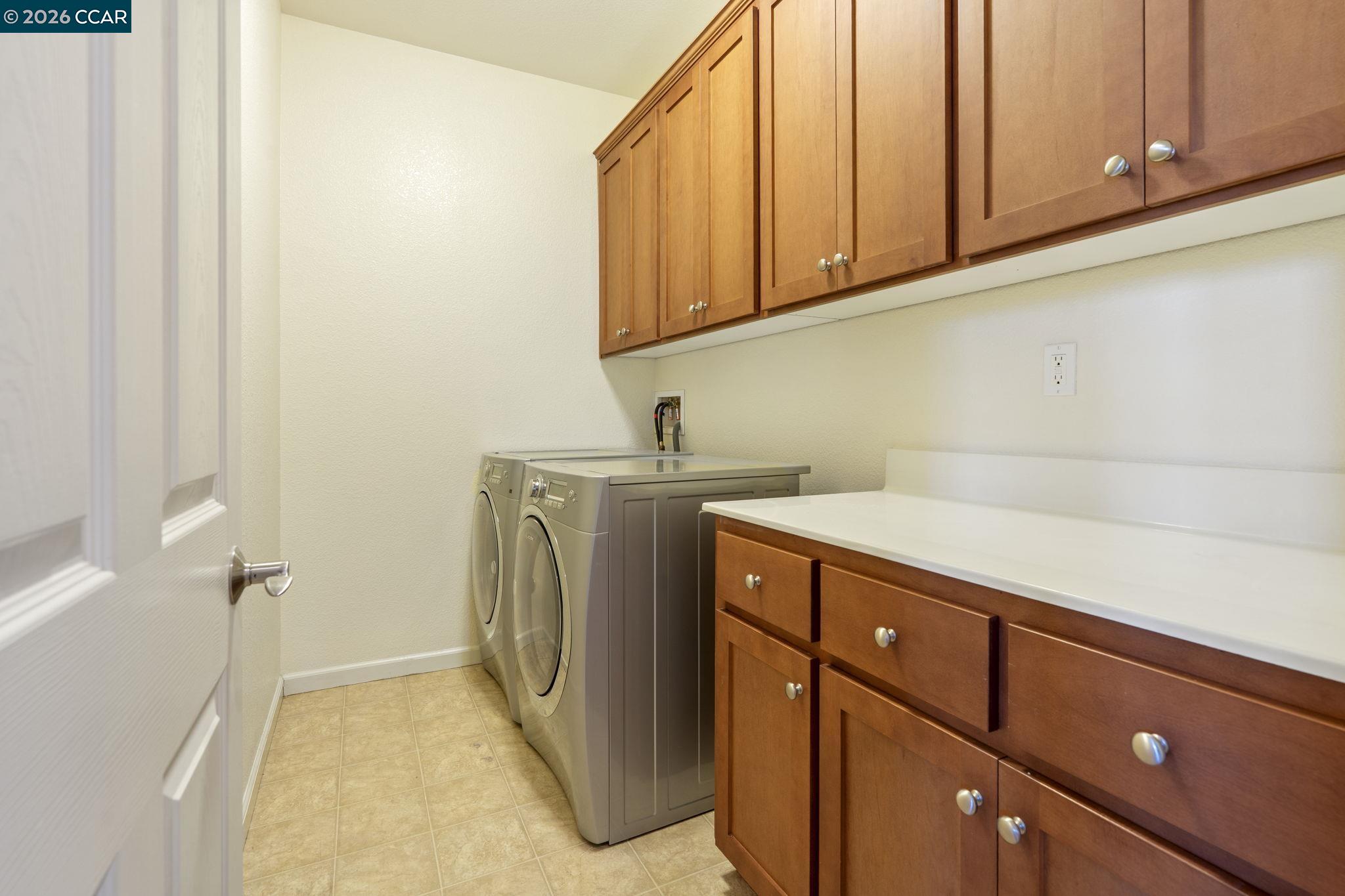5141 Fern Ridge Circle Discovery Bay, CA 94505 - Photo 36 of 56 a utility room with cabinets