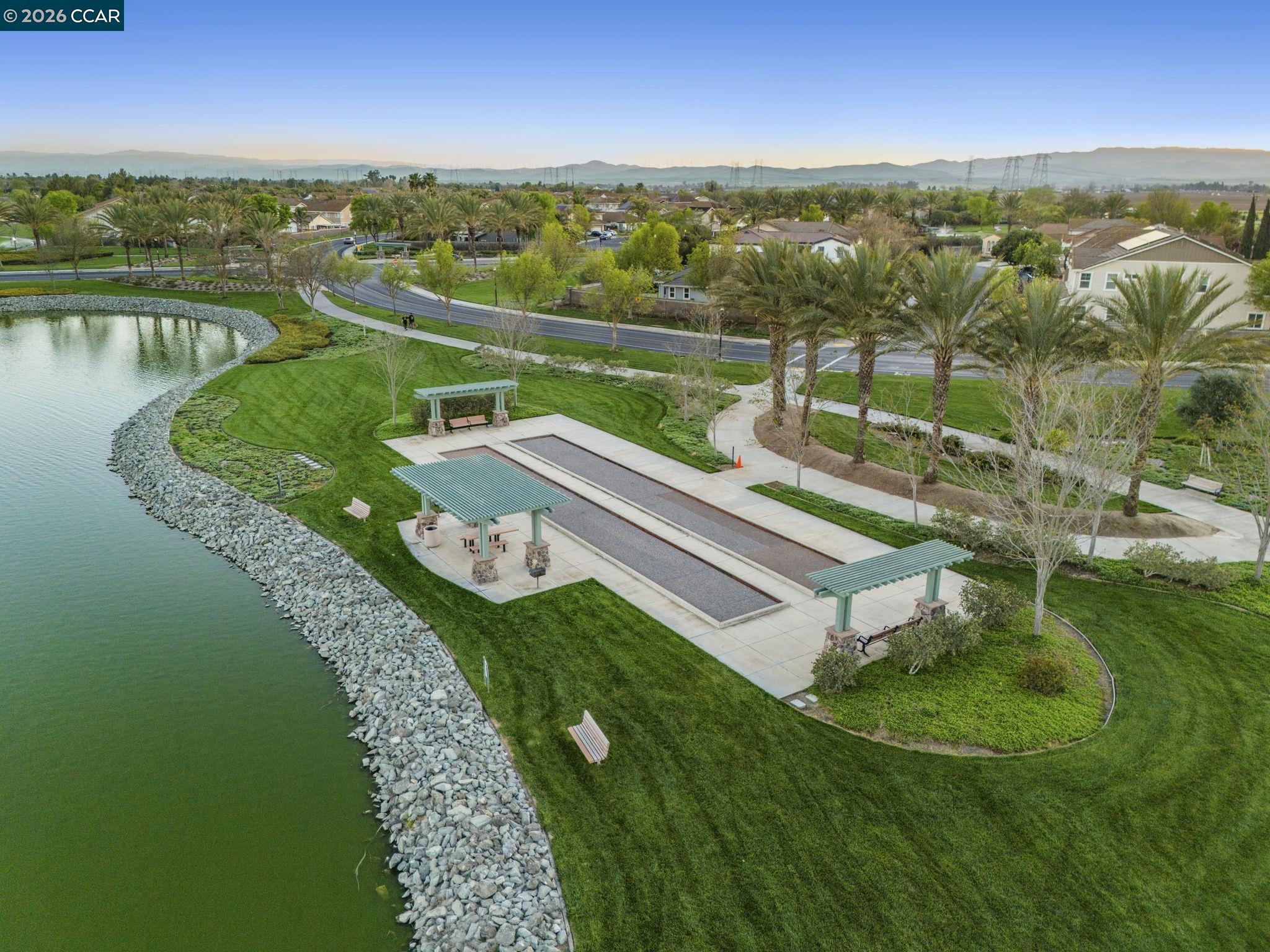 5141 Fern Ridge Circle Discovery Bay, CA 94505 - Photo 53 of 56 a view of a lake with a yard