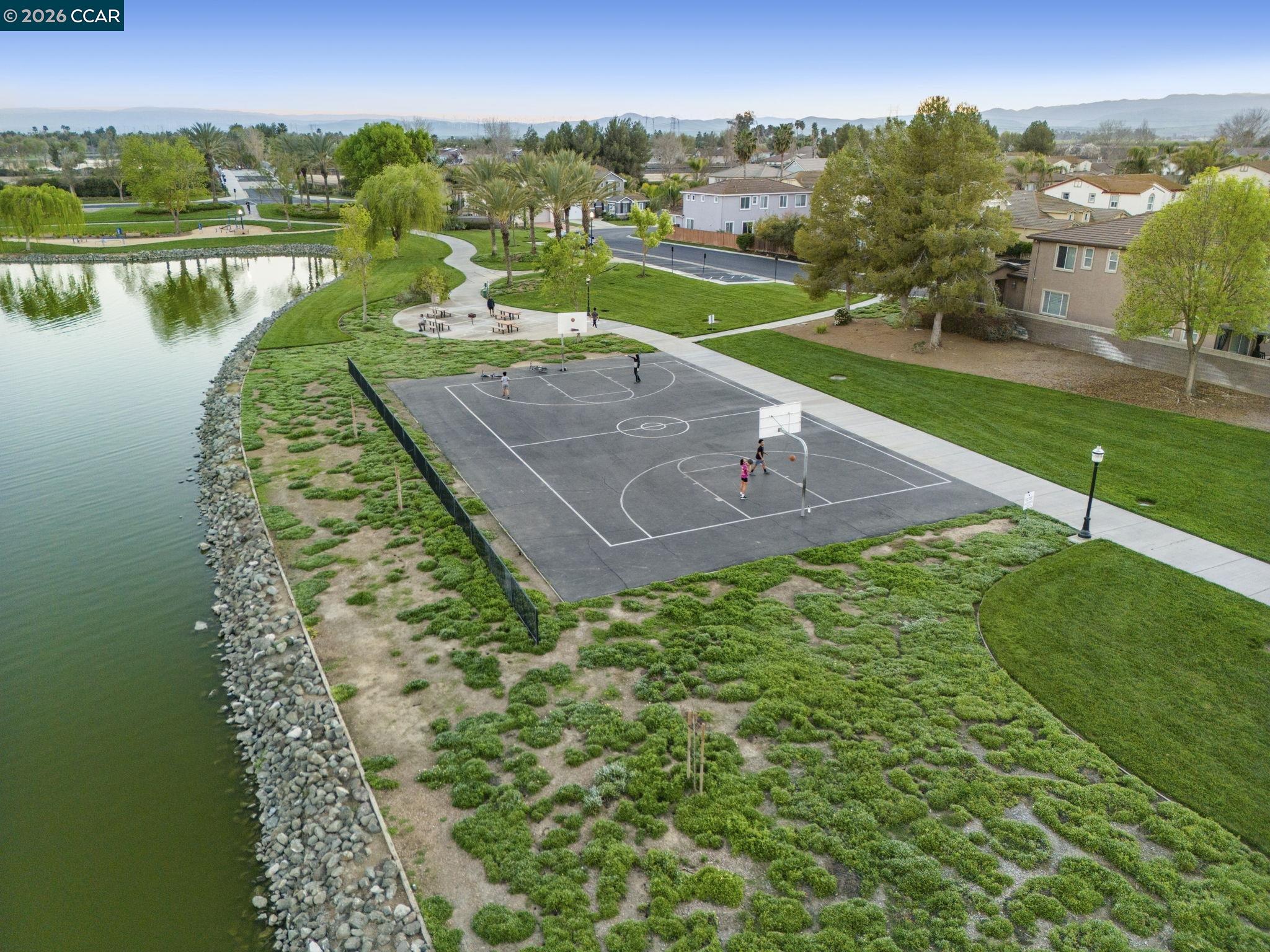 5141 Fern Ridge Circle Discovery Bay, CA 94505 - Photo 55 of 56 an aerial view of a house with a yard and lake view