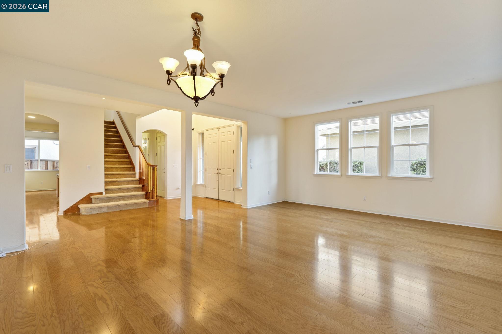 5141 Fern Ridge Circle Discovery Bay, CA 94505 - Photo 8 of 56 a view of an empty room with wooden floor and a window