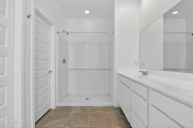 a bathroom with a shower and a tub