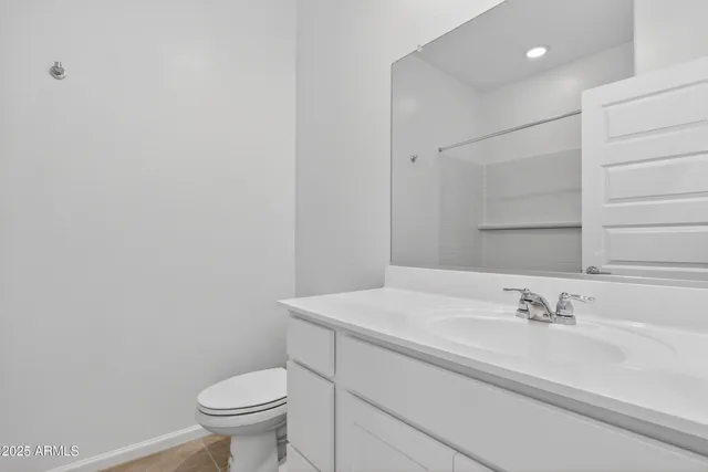 a bathroom with a sink toilet and vanity