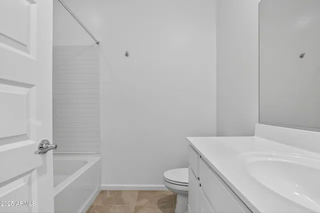 a bathroom with a sink a toilet and bathtub