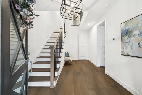 a view of entryway with stairs and wooden floor