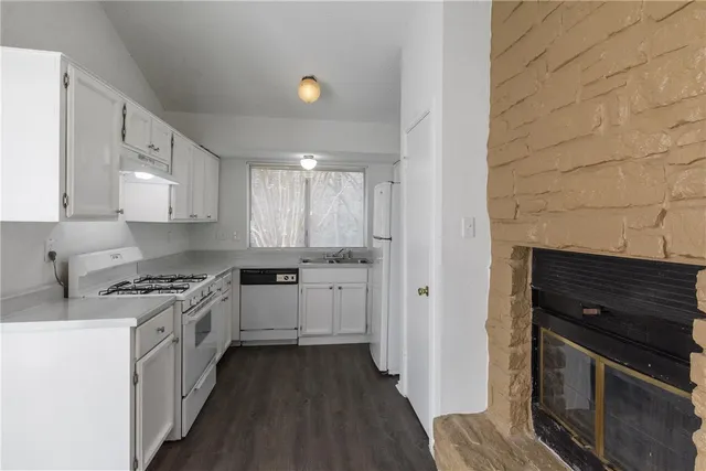 a kitchen with a stove and a refrigerator