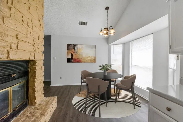 a workspace with wooden floor and a fireplace