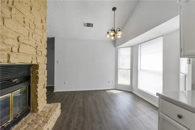 a view of livingroom with hardwood floor and kitchen