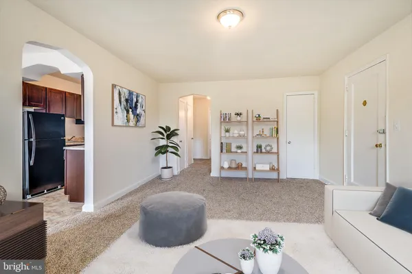 a living room with furniture and window