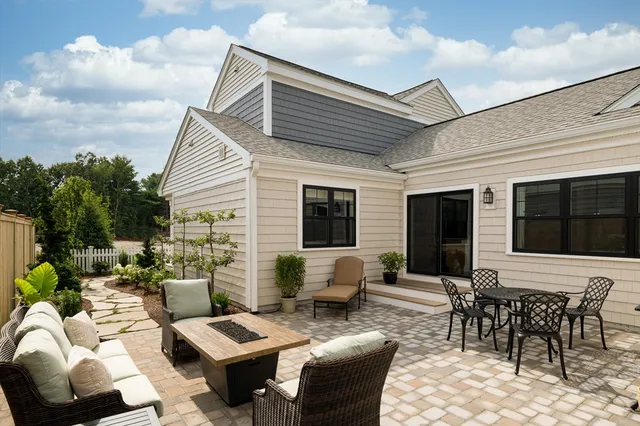 a outdoor space with patio the couches and a dining table with garden view