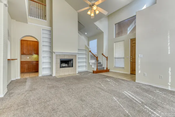 a view of an empty room with a fireplace