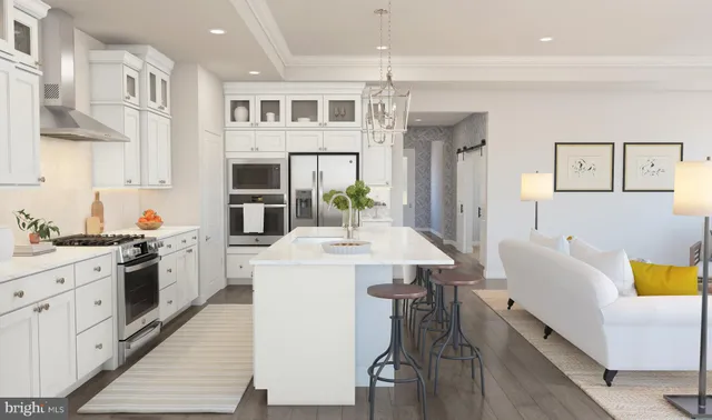 a kitchen with a sink a stove and chairs