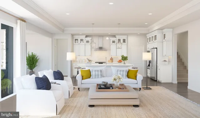 a living room with furniture fireplace and dining table
