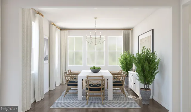 a dining room with furniture window and wooden floor