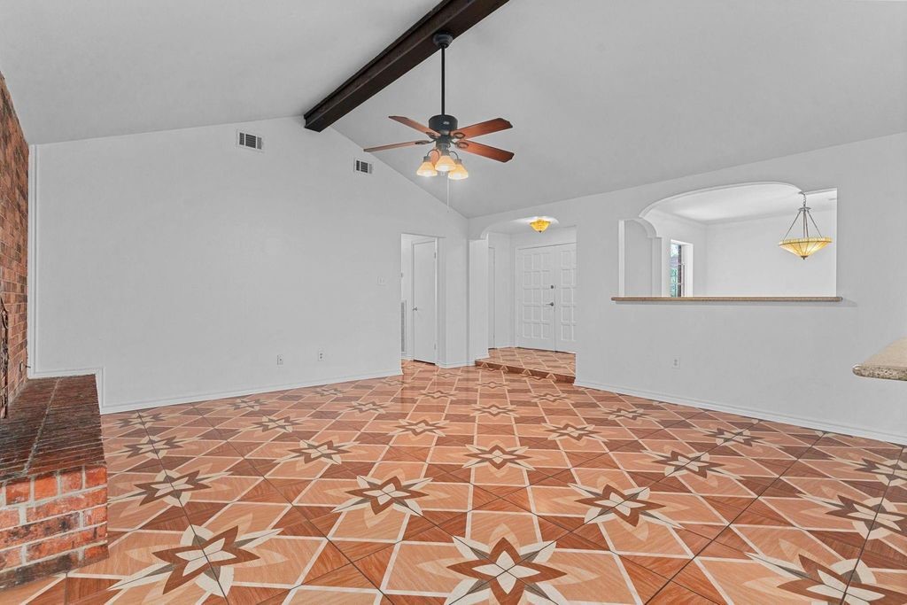 8918 Grape Street Houston, TX 77036 - Photo 15 of 40 a bedroom with a bed and a chandelier fan