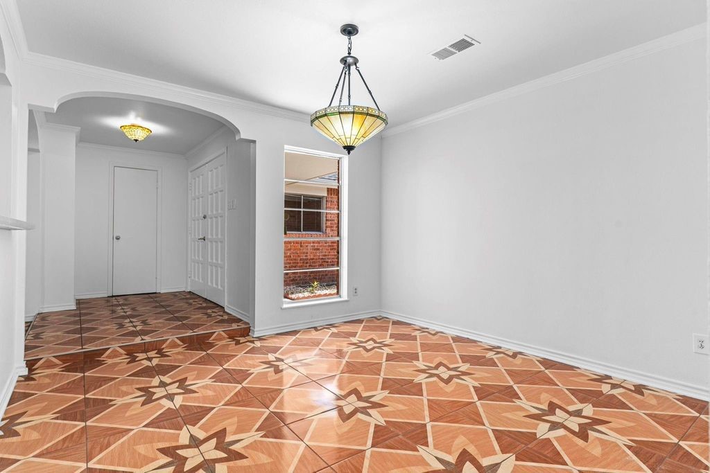 8918 Grape Street Houston, TX 77036 - Photo 17 of 40 a view of a room with wooden floor and white walls