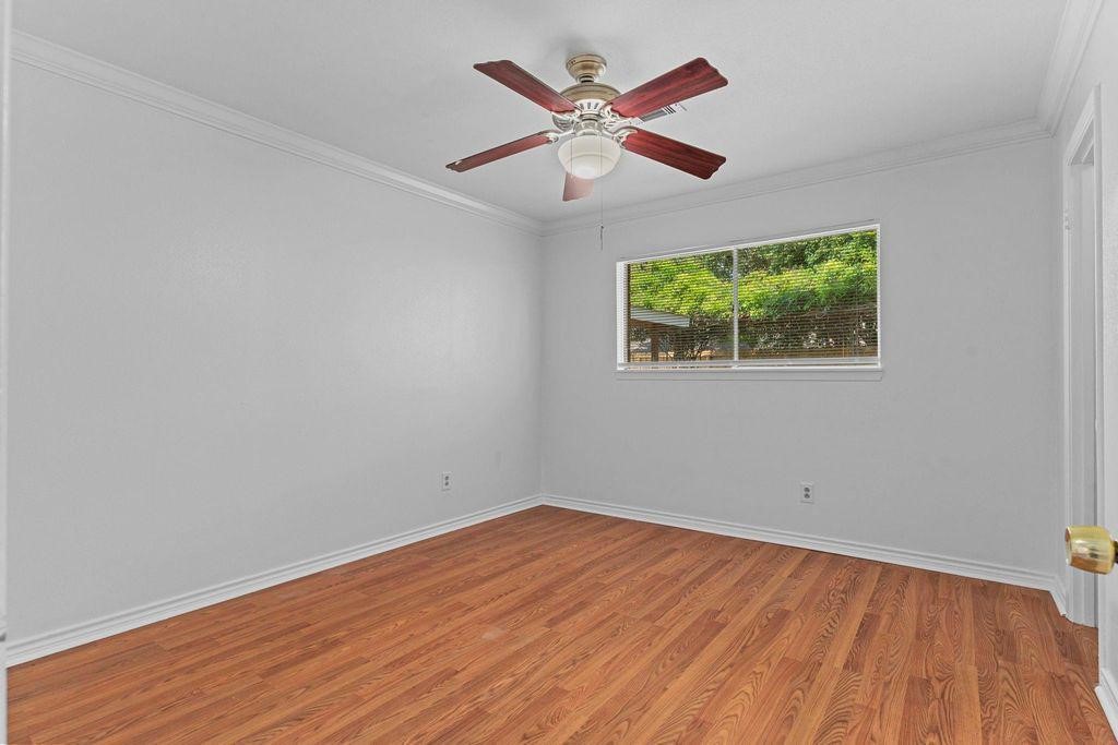 8918 Grape Street Houston, TX 77036 - Photo 19 of 40 wooden floor in an empty room with a window
