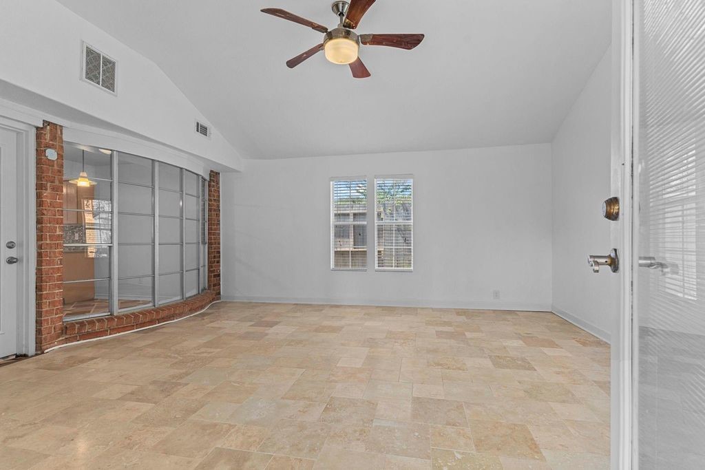 8918 Grape Street Houston, TX 77036 - Photo 24 of 40 a view of an empty room with a window