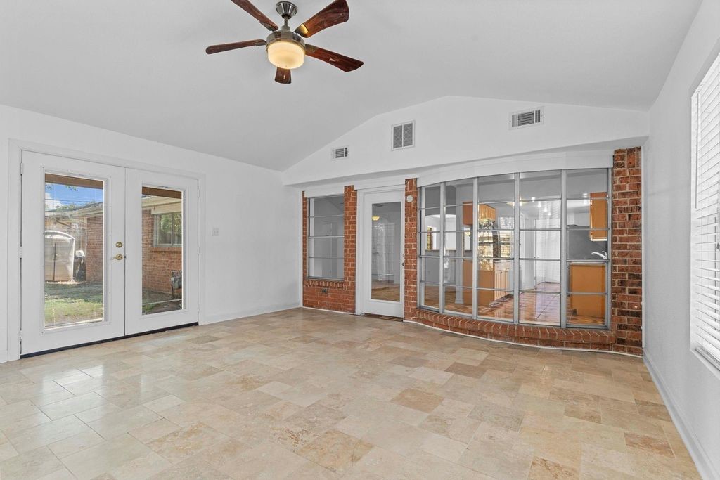 8918 Grape Street Houston, TX 77036 - Photo 25 of 40 an empty room with ceiling fan and windows