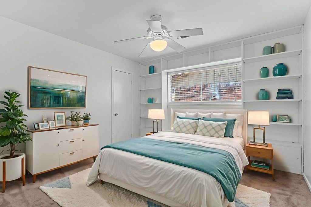 8918 Grape Street Houston, TX 77036 - Photo 31 of 40 a bedroom with a bed and a dresser in it