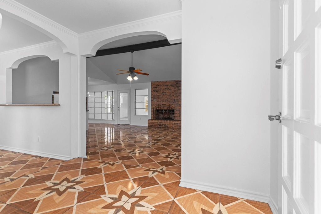 8918 Grape Street Houston, TX 77036 - Photo 5 of 40 a view of a hallway with a dining room and a window