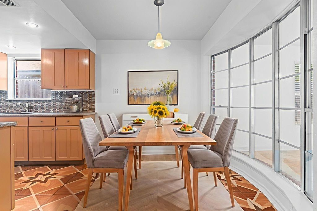 8918 Grape Street Houston, TX 77036 - Photo 7 of 40 a view of a dining room with furniture