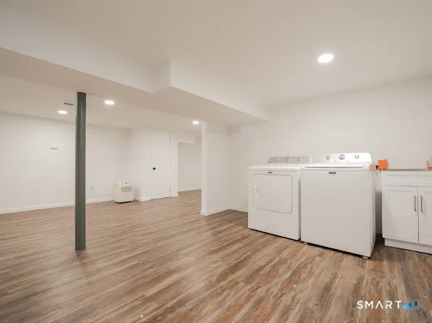 a view of a storage & utility room with wooden floor
