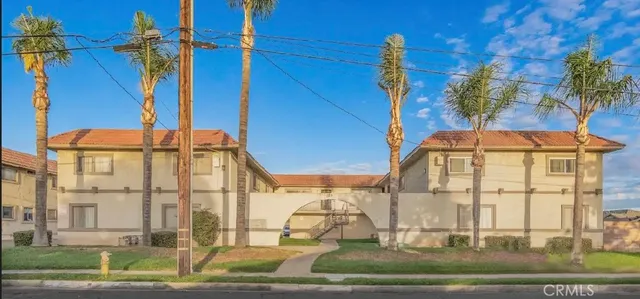 a view of a brick building with a yard