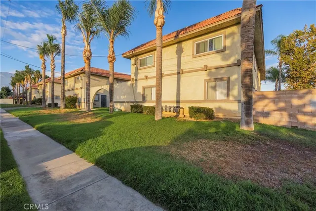 a view of a building with a yard