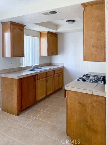 a kitchen with a stove and a sink