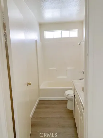 a kitchen with a stove and a white cabinet