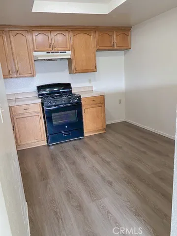 an empty room with wooden floor