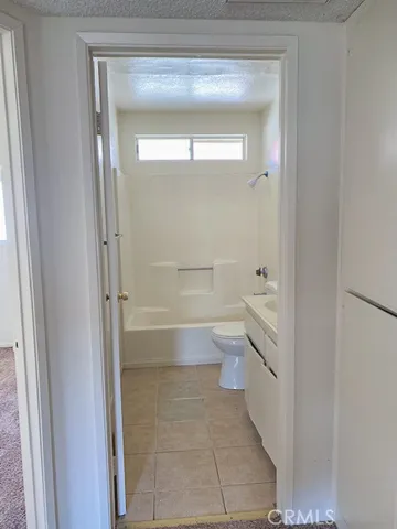 a view of swimming pool with a patio